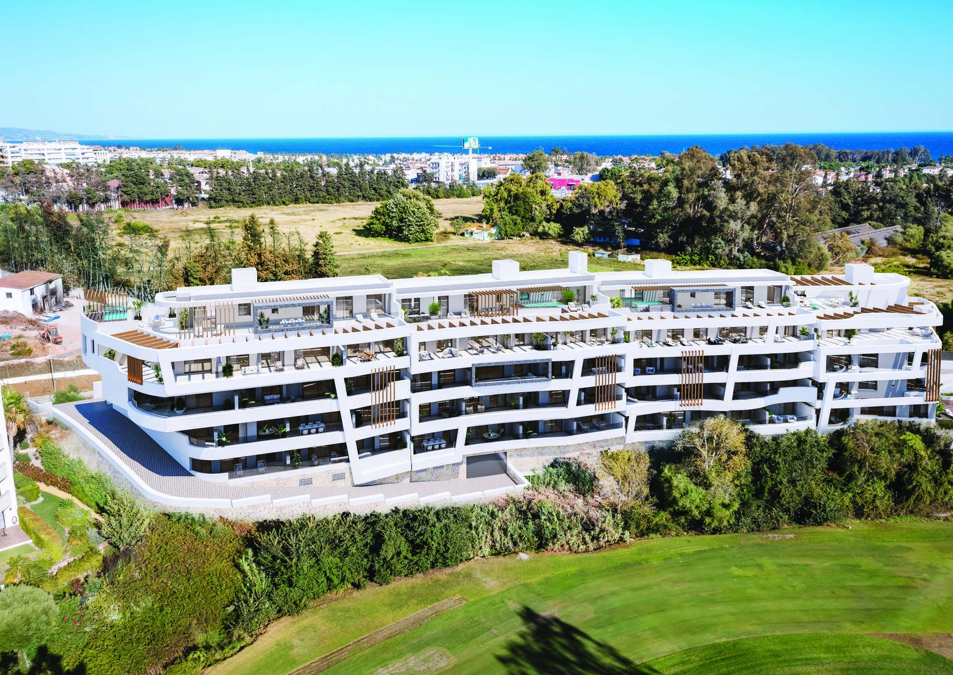 Aerial developer visual of Alisios Residences framed by the Guadalmina golf course and the sea