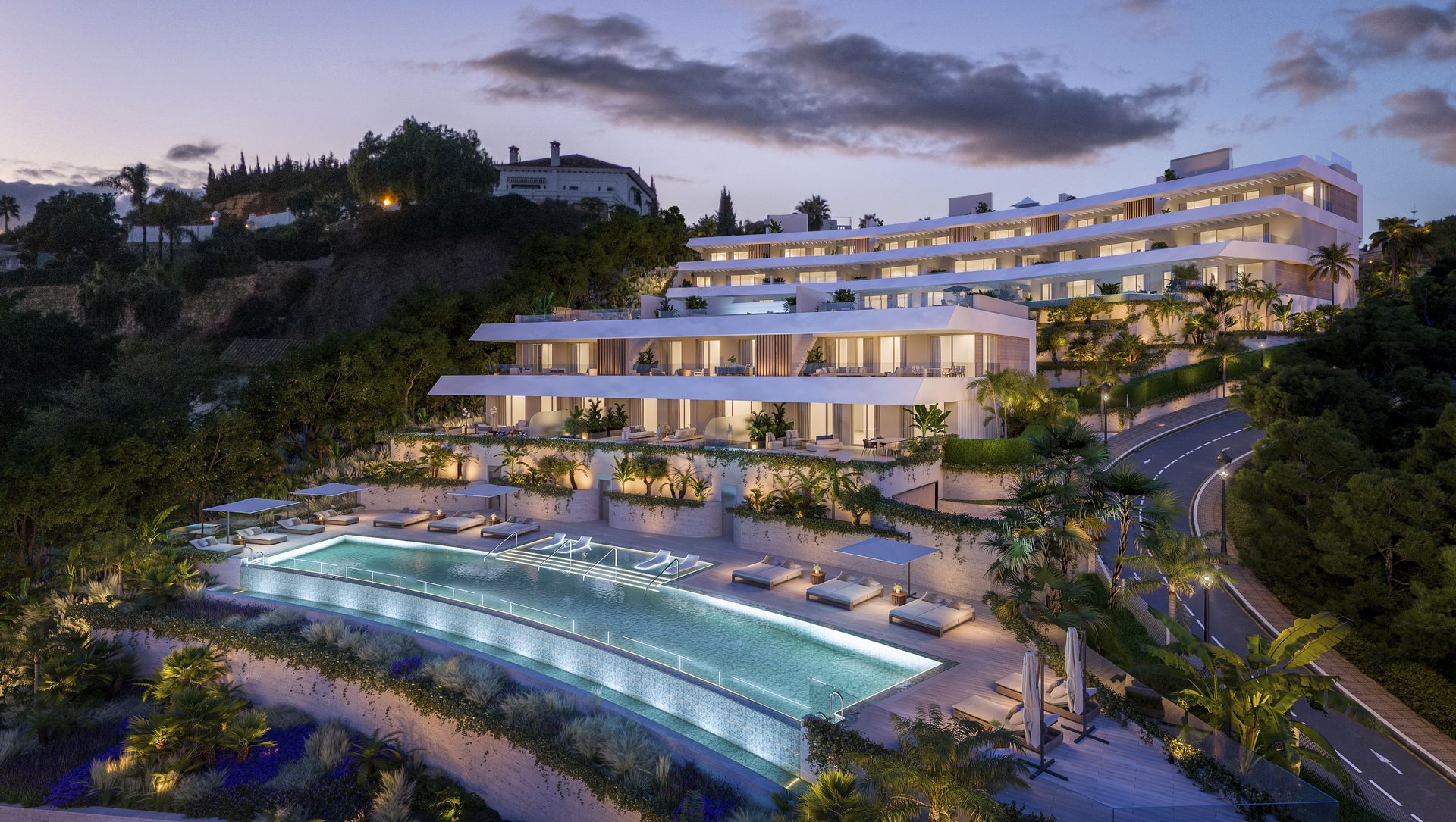 Aerial developer visual of Altos de Marbella at dusk, showing the pool terrace and hillside setting