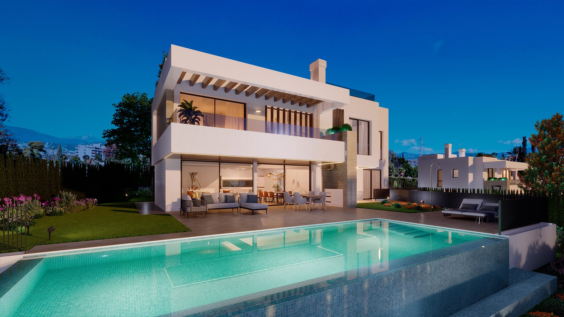 La villa y la terraza de la piscina al anochecer