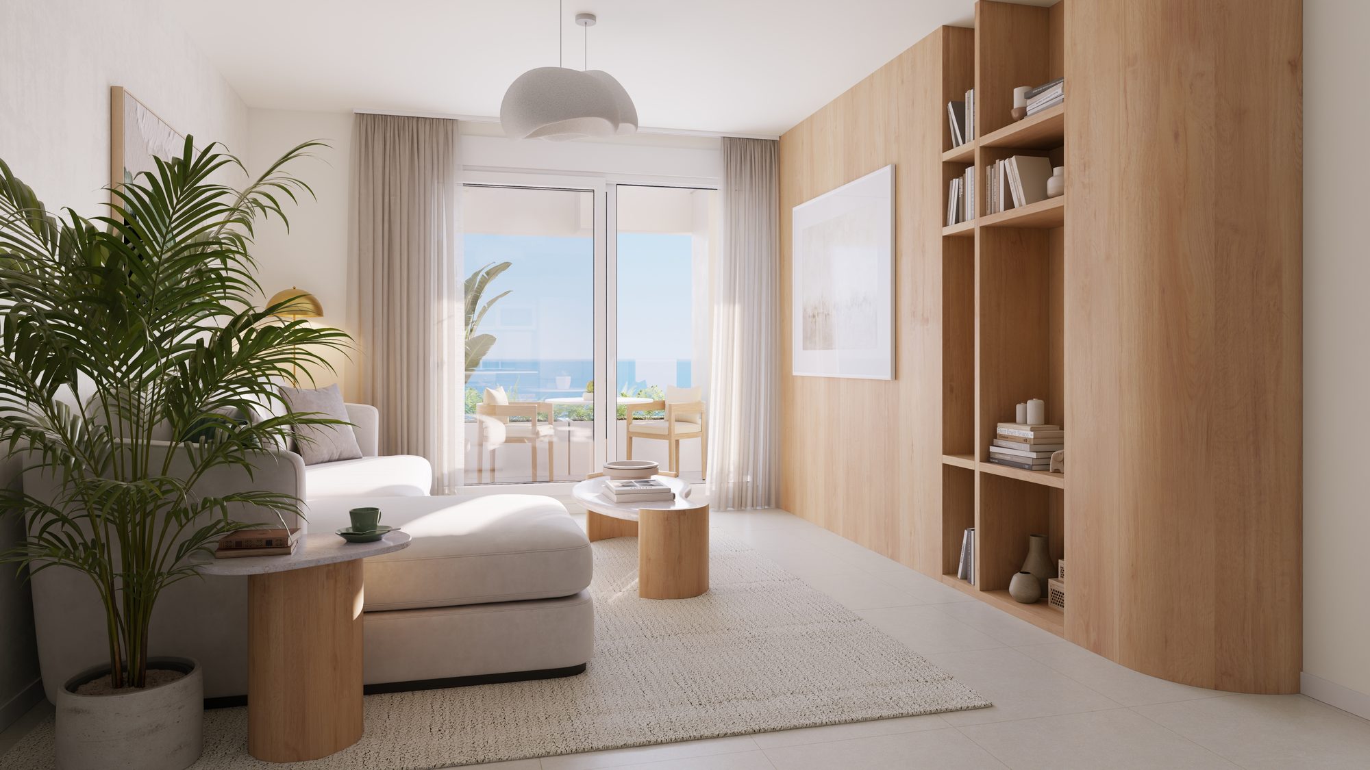 Das Wohnzimmer mit Einbauregal und einem Fenster zum Meer