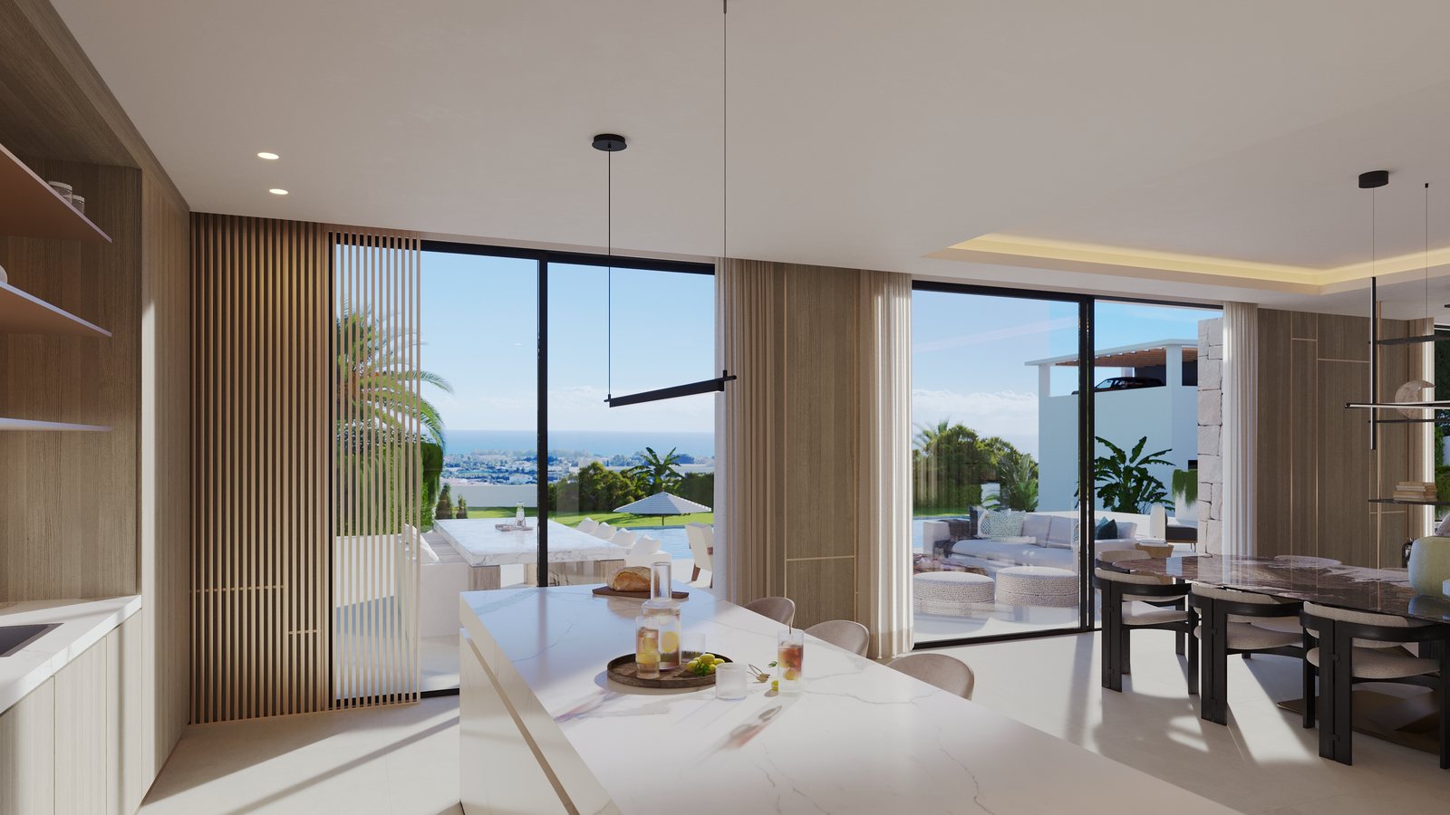 The kitchen looking out over the terrace to the coast