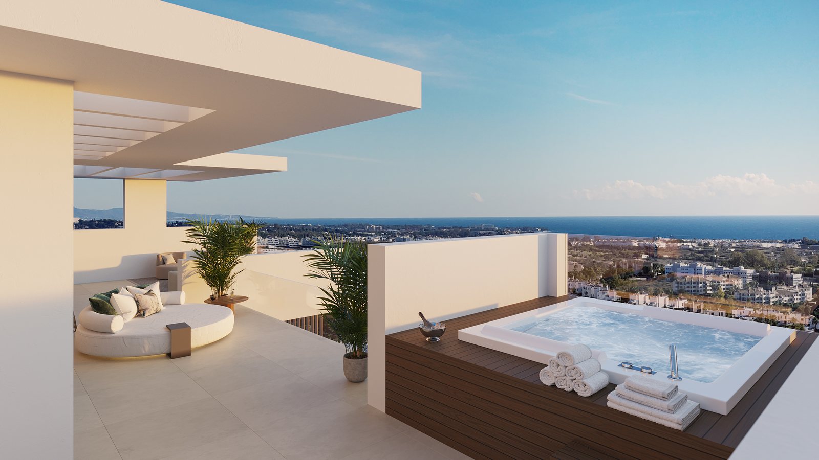 An upper terrace with a sunken seating area, the coast along the horizon