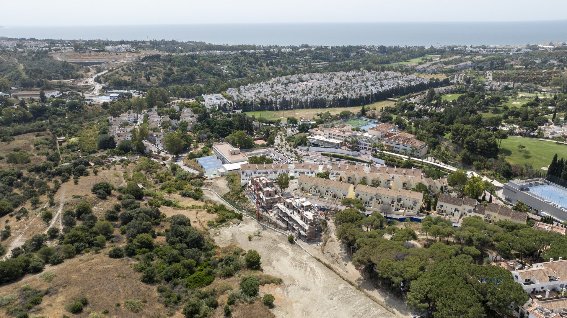 Aerial view of Phase I construction progress alongside the Phase II plot