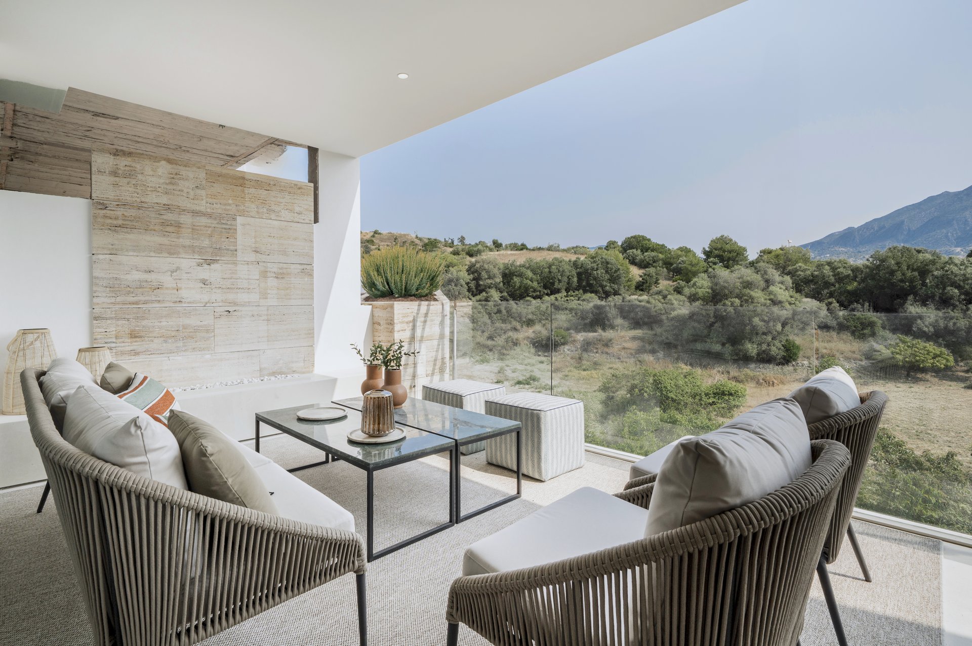 Terrace lounge seating overlooking the surrounding hillside