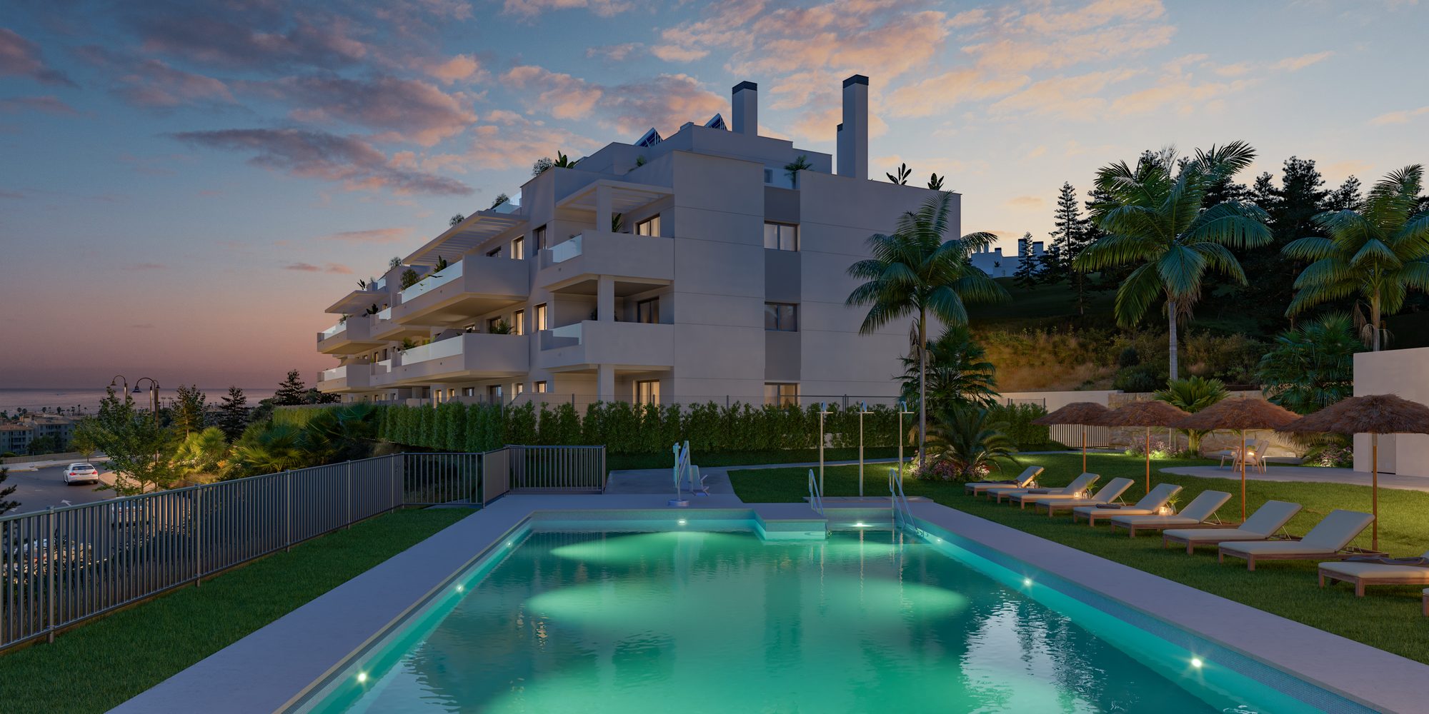 Developer visual of the communal pool at dusk, loungers and parasols along its edge