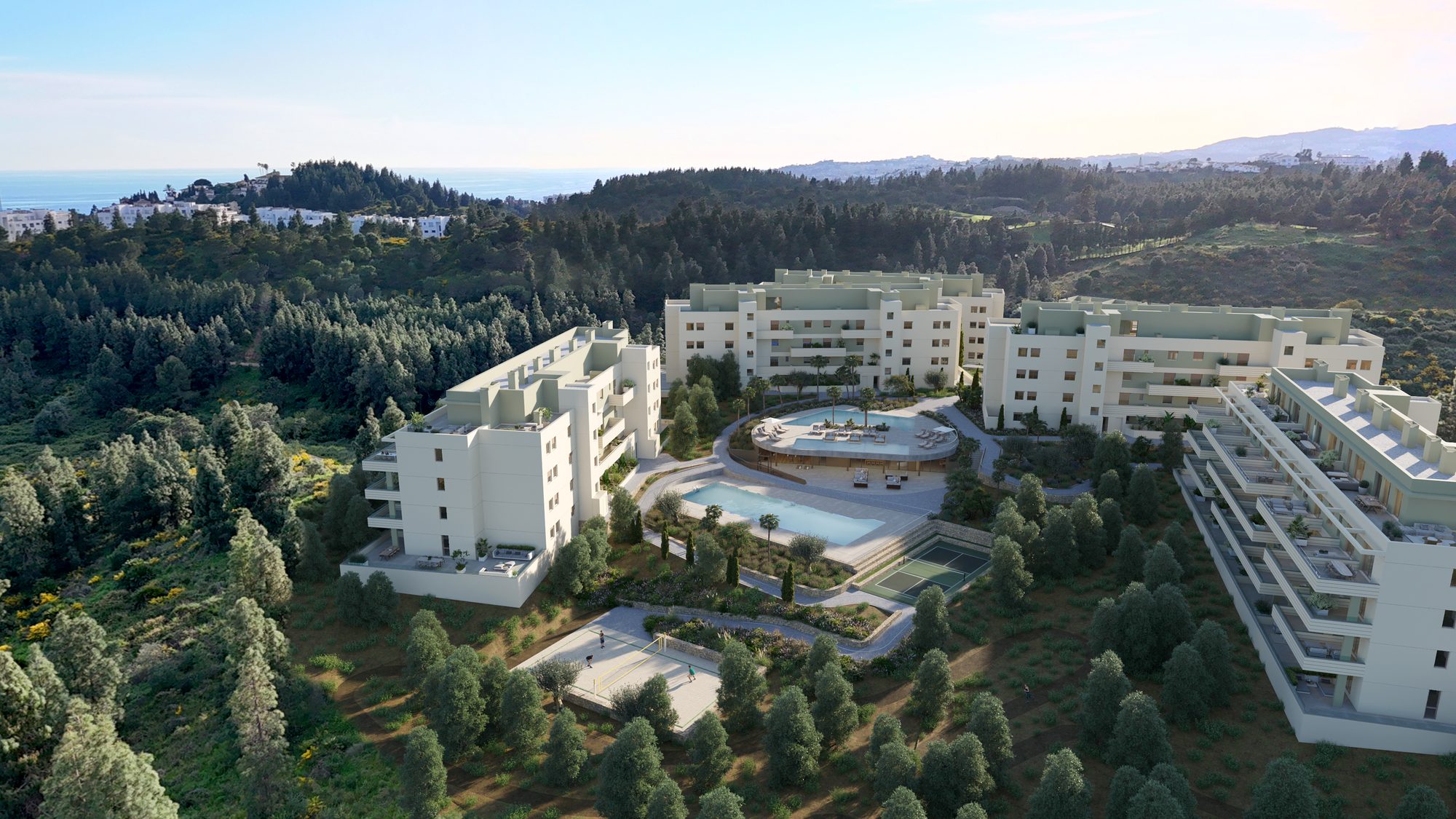 Die gestaffelten Gebäude am bewaldeten Hang rund um die Poolterrasse