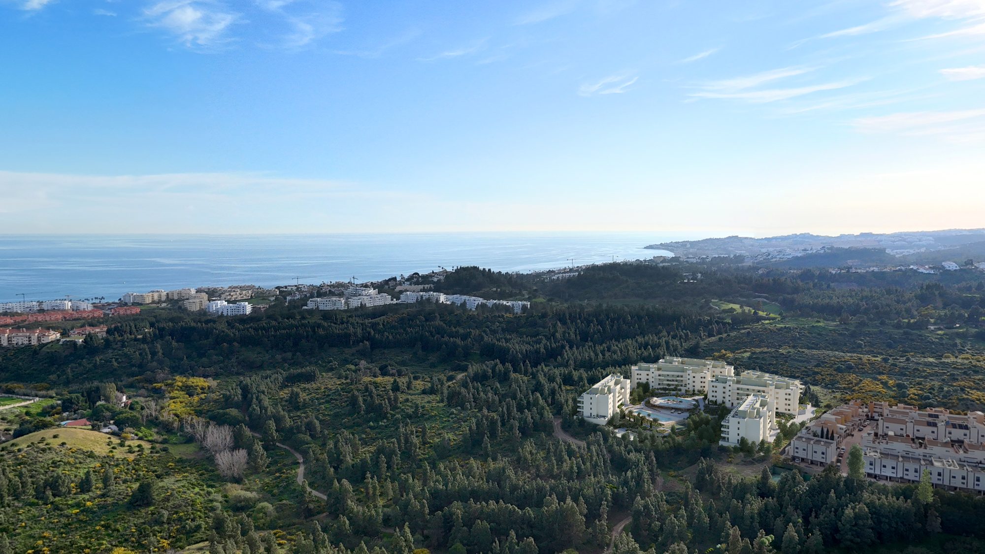 Bauträger-Visualisierung mit Blick über die bewaldeten Hügel zur Küste und zum Meer