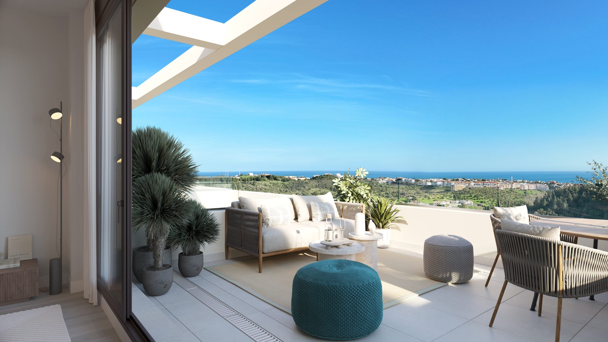 Bauträger-Visualisierung einer Terrassenecke mit Sofa, Pflanzkübeln und dem Meer dahinter