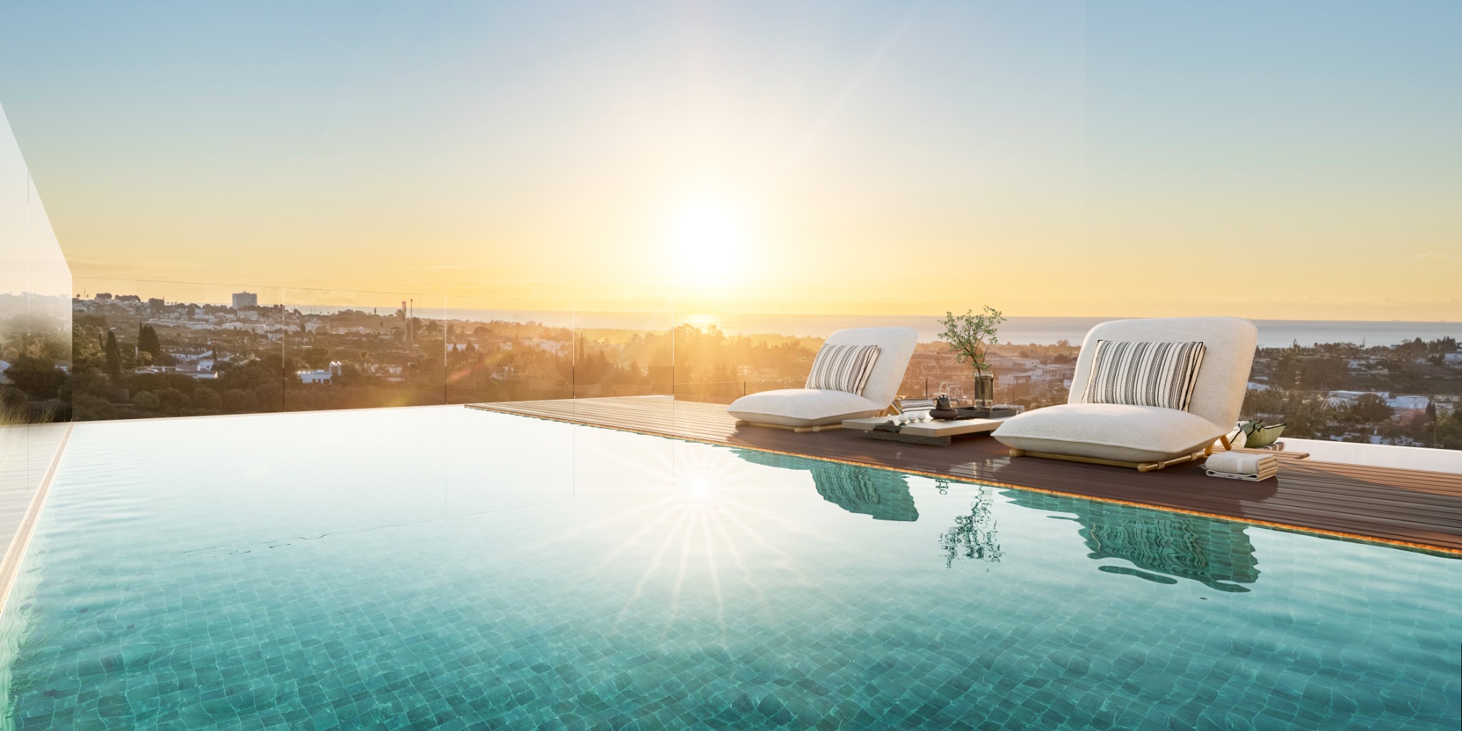Private pool terrace at sunset with coastal views