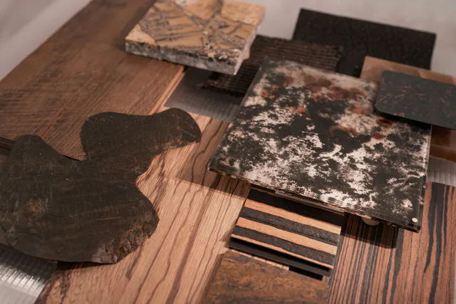 Curated samples of timber, stone and engineered finishes selected for a new residence